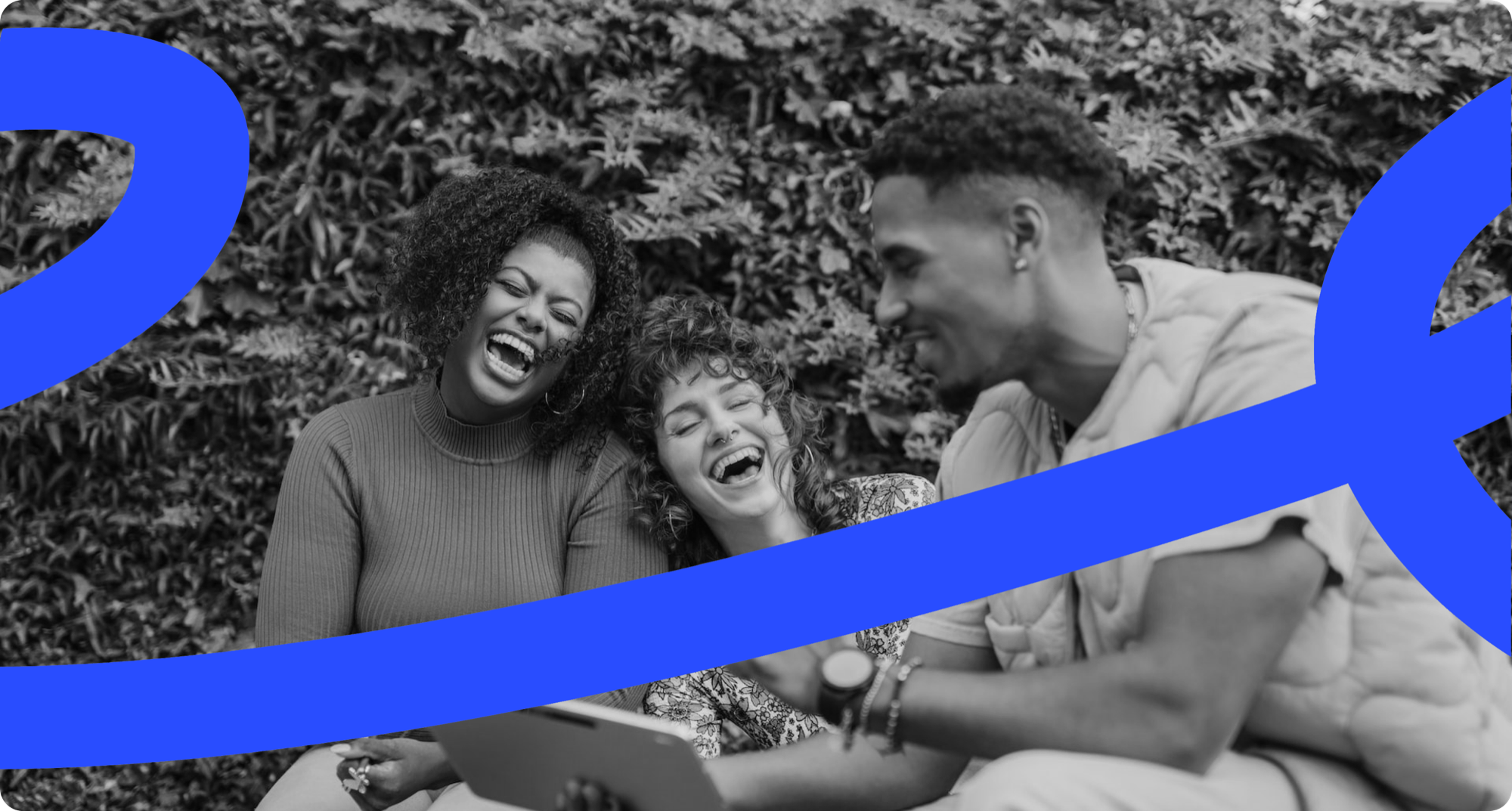 A group of colleagues laughing together outdoors